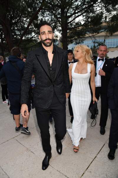 Pamela Anderson et son compagnon Adil Rami lors de la soirée Amber Lounge Monaco 2019