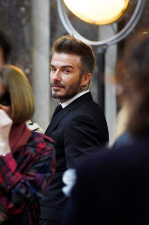 David Beckham qui regarde sa femme à la fashion week de New York, le 11 février 2018