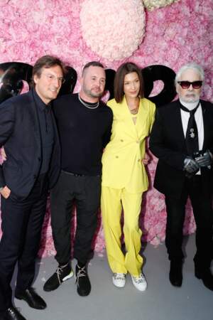 Le total look jaune acidulé de Bella Hadid au défilé Dior Homme