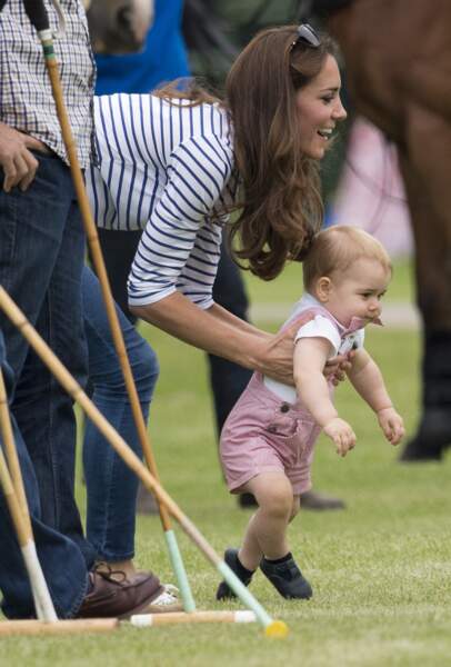 Le prince George le 15 juin 2014, lors d'un match de polo de son père, le prince William, et de son oncle, le prince Harry