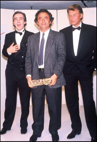 En 1988, Richard Bohringer entouré de Pierre Arditi et Johnny Hallyday lors de la cérémonie des César.