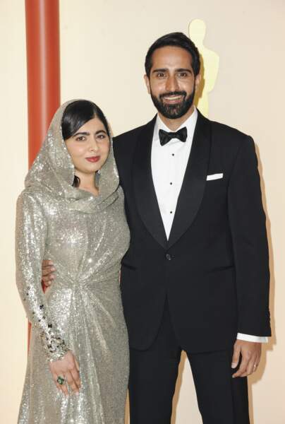 L'activiste et productrice Malala Yousafzai est accompagnée de son mari Asser Malik lors de la 95ème cérémonie des oscars le 12 mars 2023  