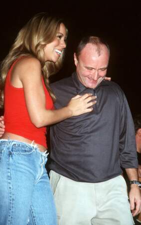 Phil Collins aux côtés de Mariah Carey pour un concert à New York en 1999 (48 ans)
