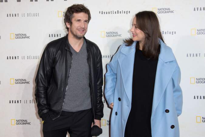 En 2016, Guillaume Canet (43 ans) et sa femme Marion Cotillard enceinte, lors de la première du documentaire Before the Flood à Paris