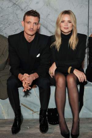 Niels Schneider et Virginie Efira lors du défilé de la collection femme prêt-à-porter Printemps-Été 2024 d'Yves Saint Laurent durant la Fashion Week de Paris
